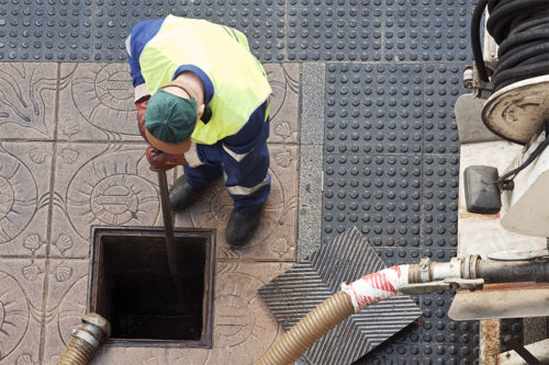 commercial drain being cleaned