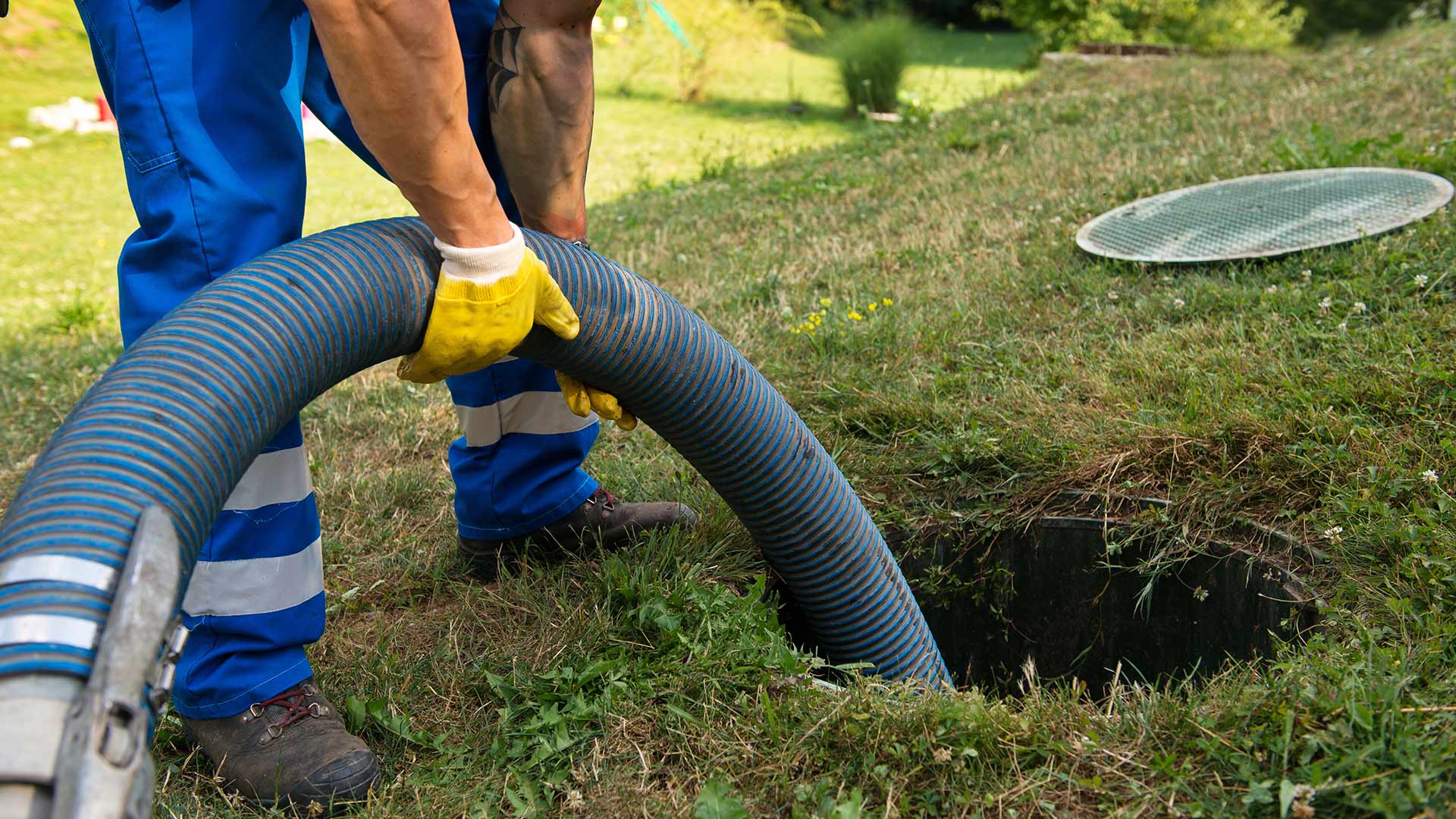 man holding a drain cleaning pipe mahwah nj
